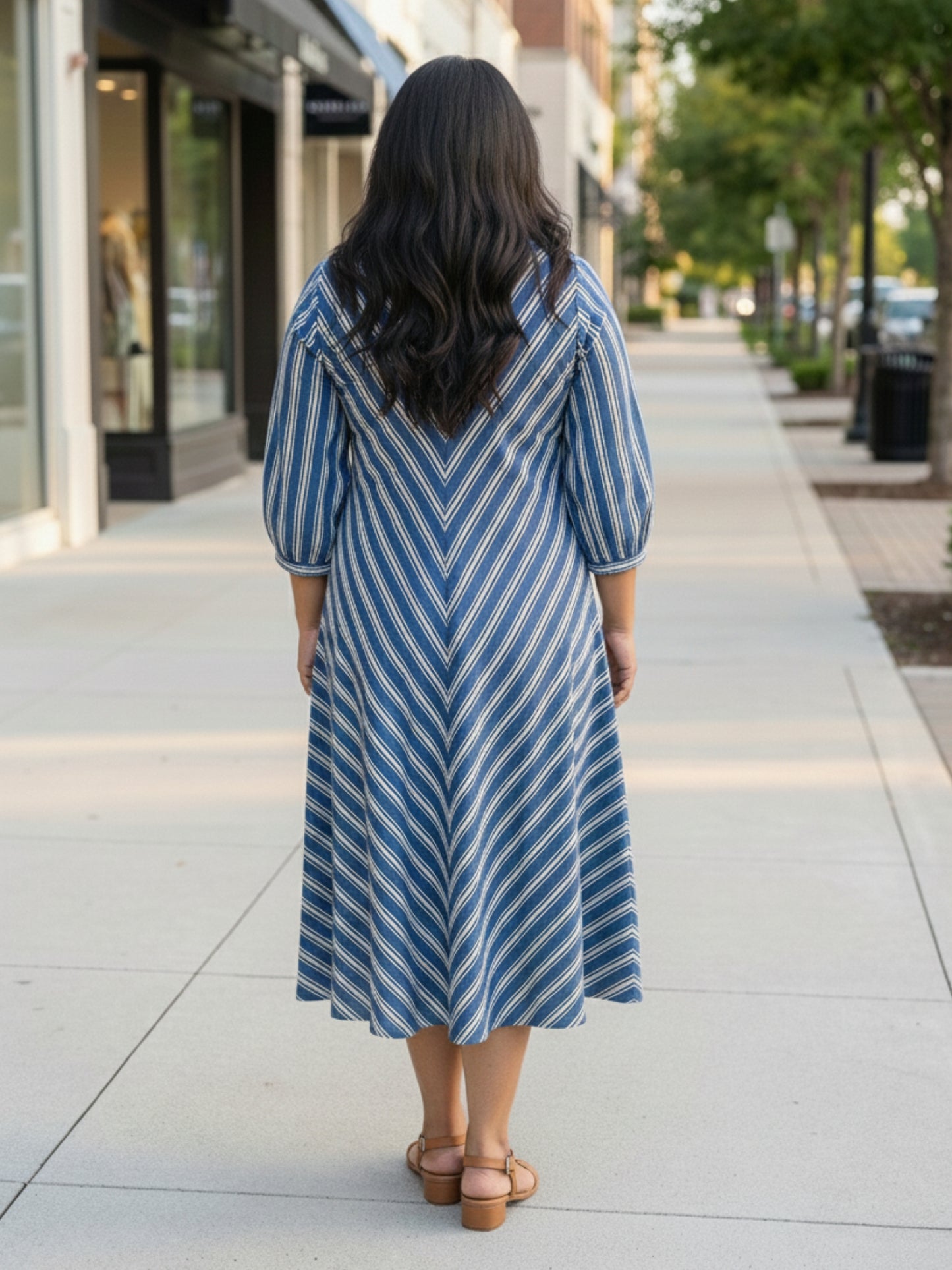Blue striped dress for women, back view, clean silhouette with vertical stripes and comfortable fall