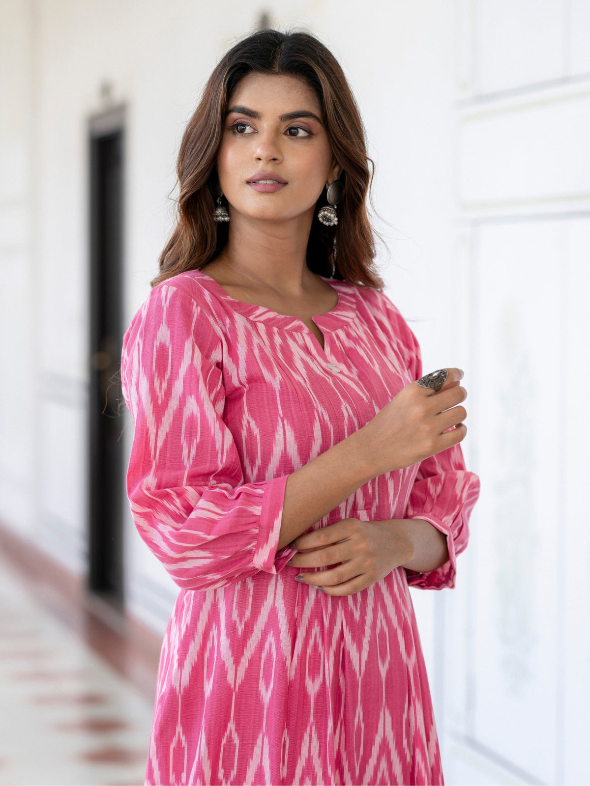 Close-up detail of handloom Ikat fabric on pink kurta set