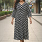 Black striped dress for women, front view, handcrafted cotton dress with relaxed fit and pockets