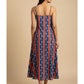Back view of pure cotton ikat noodle strap dress featuring bold blue and red stripes, handmade craftsmanship, and a free-flowing fit.
