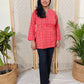 Orange top with front pockets in ikat cotton