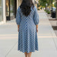 Blue striped dress for women, back view, clean silhouette with vertical stripes and comfortable fall