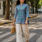 Aster Blue Cotton Top for women in pure cotton featuring pink floral motifs and a comfortable relaxed fit.