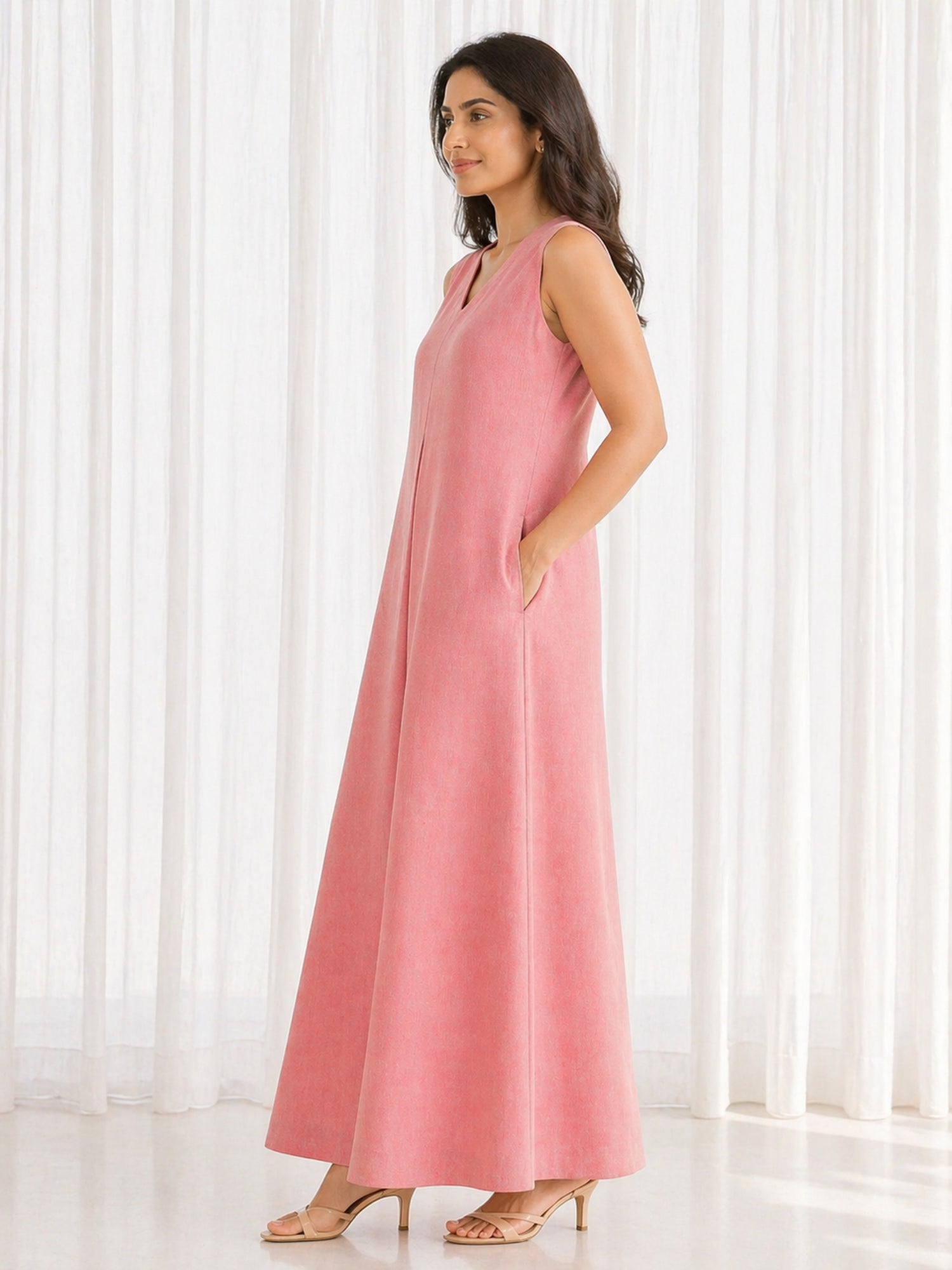 Side profile of Urban Peach Flow Dress showing free-flowing A-line silhouette and side pocket detail.