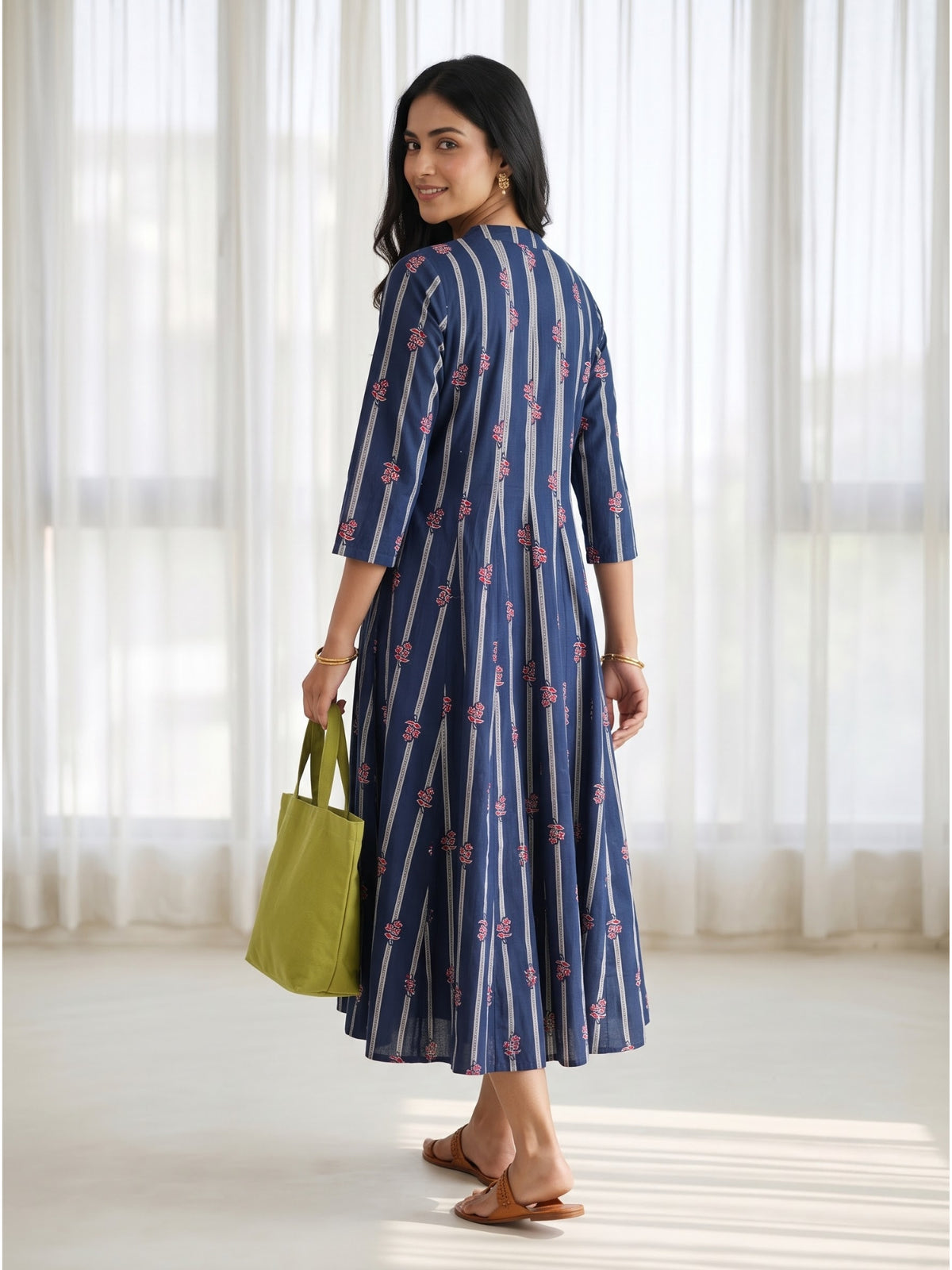 Mehr striped cotton dress in navy blue with delicate red floral motifs, relaxed fit and elegant shoulder-to-hem panels.