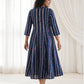Back view of Mehr Navy Cotton Kalidaar Dress showing continuous shoulder-to-hem panels, vertical stripes and a graceful flared silhouette.