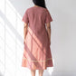 Aarika Rosewood Ikat cotton dress for women twirl pose highlighting the flared hem and movement
