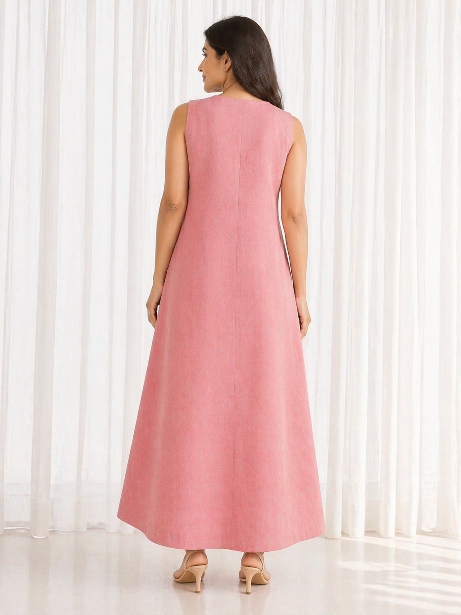 Back view of Urban Peach Flow Dress in peach handloom cotton, full length elegant maxi fit.