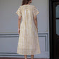 Woman wearing Darzaania The Weekend Dress, a pure cotton handblock stripe midi dress, viewed from the back