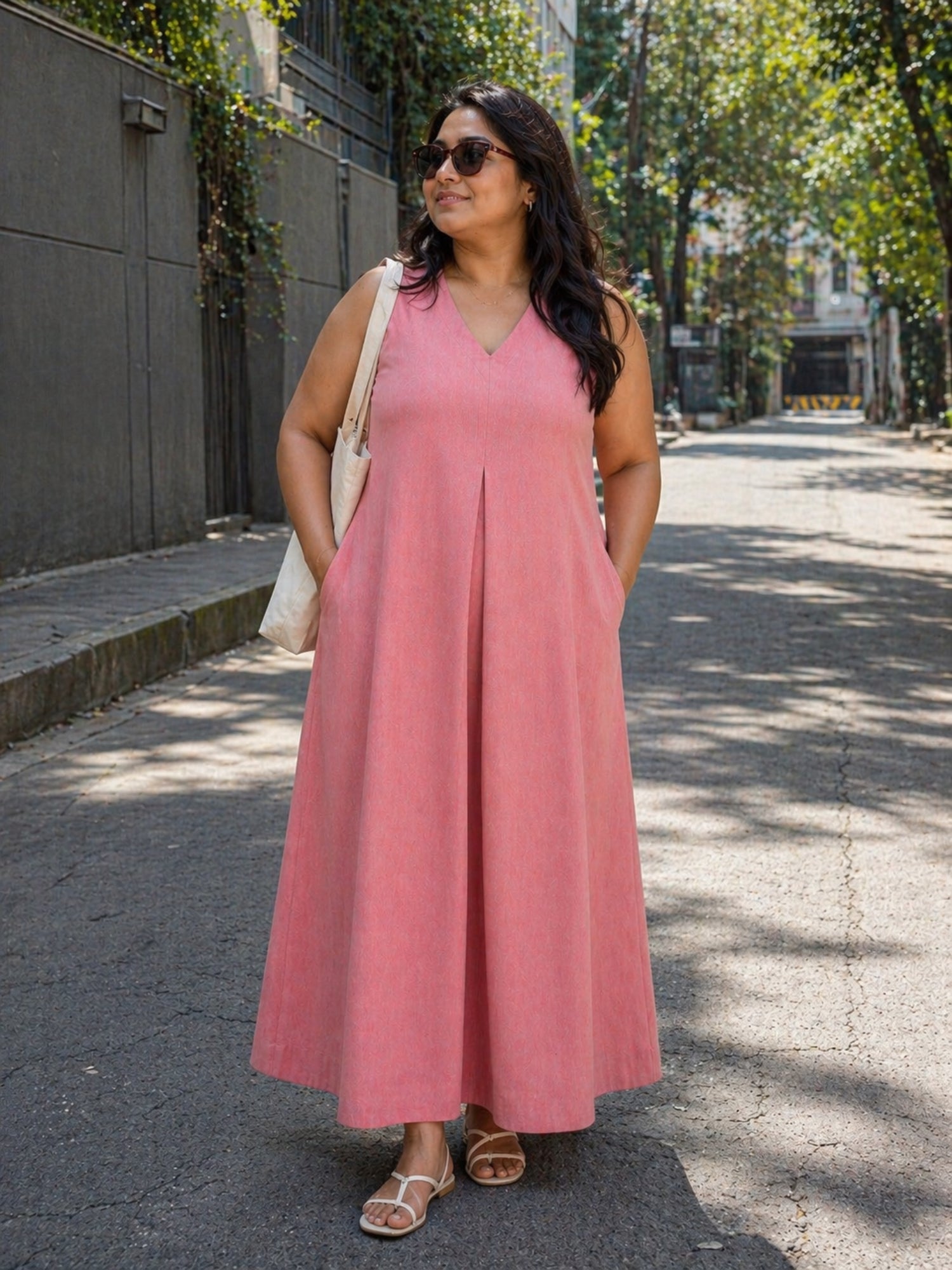 Front view of Urban Peach Flow Dress in handloom ikat cotton on model, full length maxi dress with pockets.