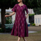 Close-up of wine Ikkat fabric used in the midi dress