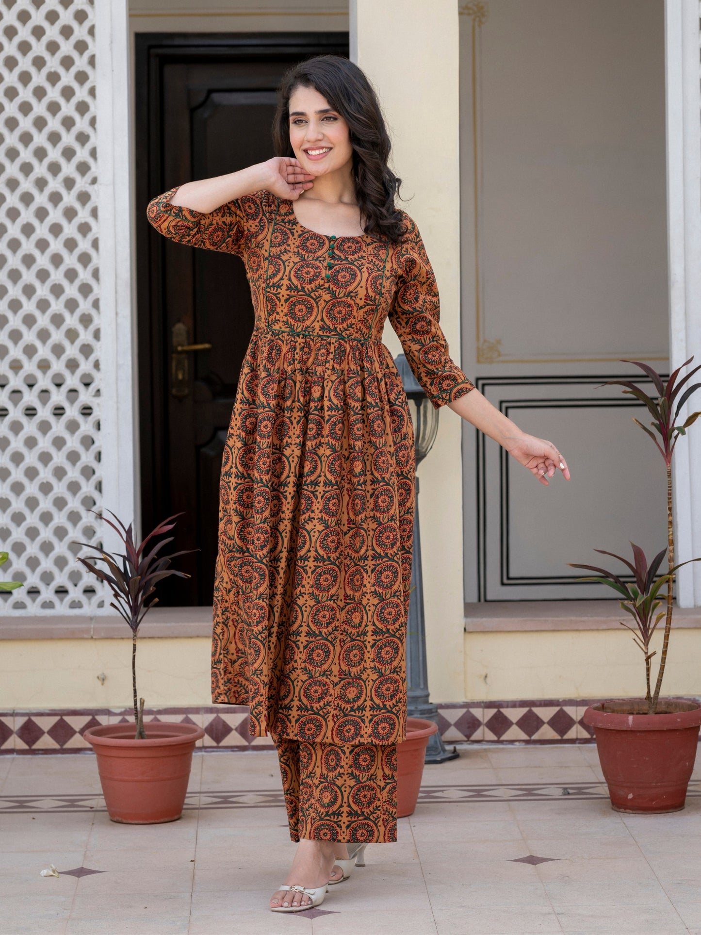 Woman wearing Darzaania Nayra brown printed cotton kurta set front view