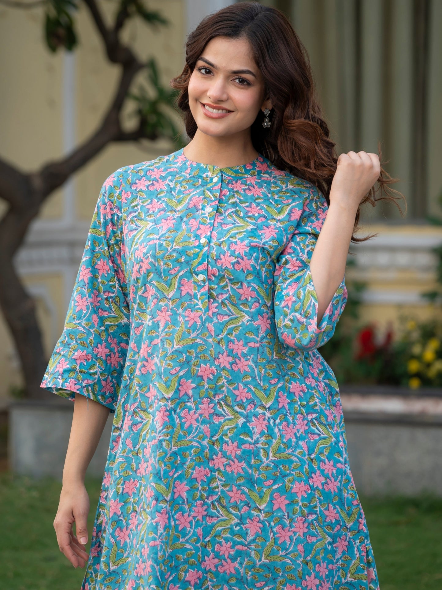 Close up of pink hand block floral print on sky blue 100 percent cotton kurta set